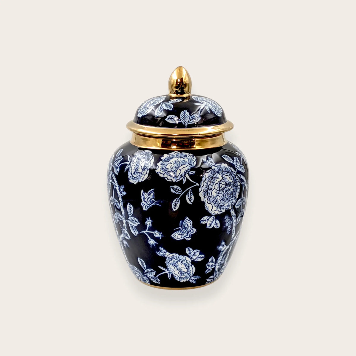 Navy blue porcelain ginger jar with white floral pattern and gold lid
