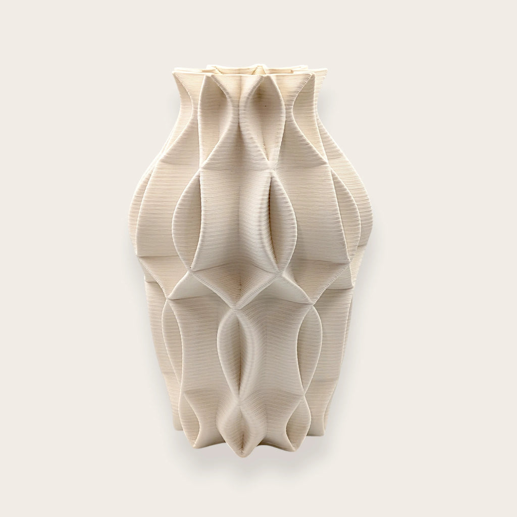Matte white architectural ceramic vase with geometric sculptural design