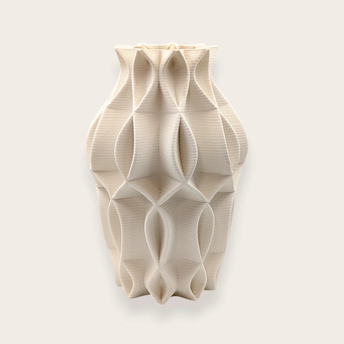 Matte white architectural ceramic vase with geometric sculptural design