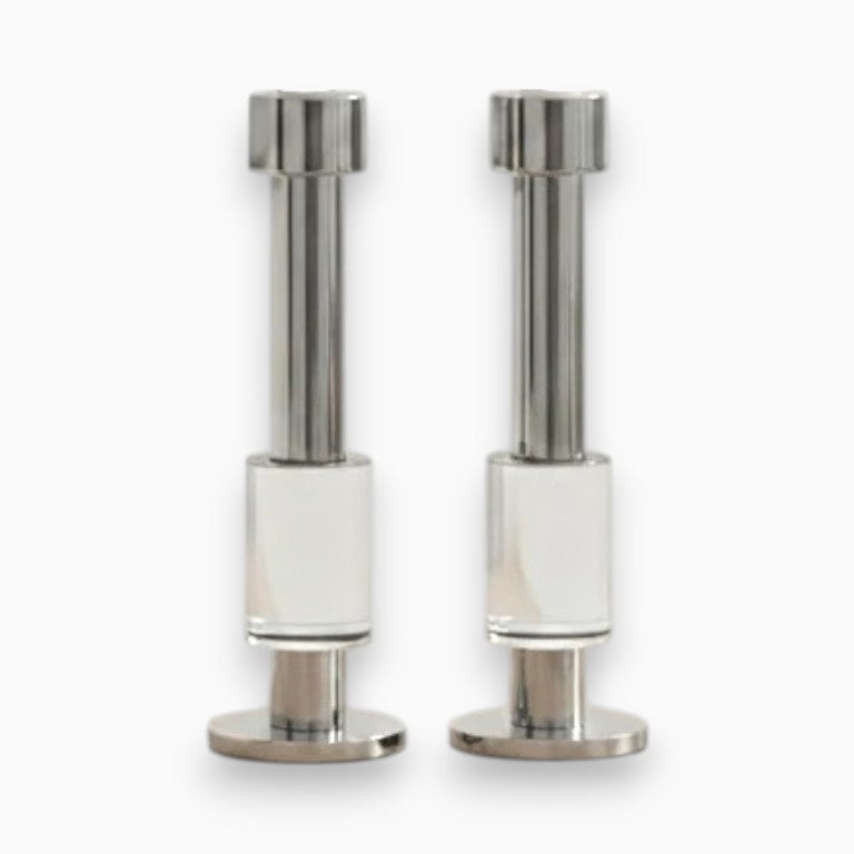 Pair of modern crystal and chrome candle holders on white background