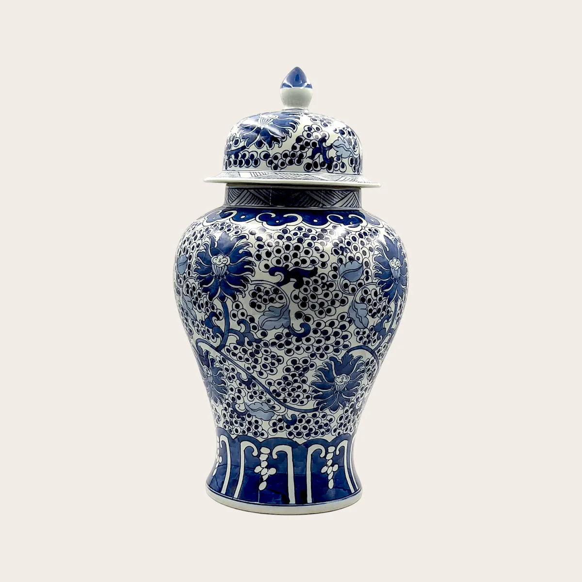 Antique fine ceramic lidded ginger jar with blue and white floral design and high-gloss glaze
