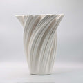 Matte white 3D printed porcelain vase with spiralled design
