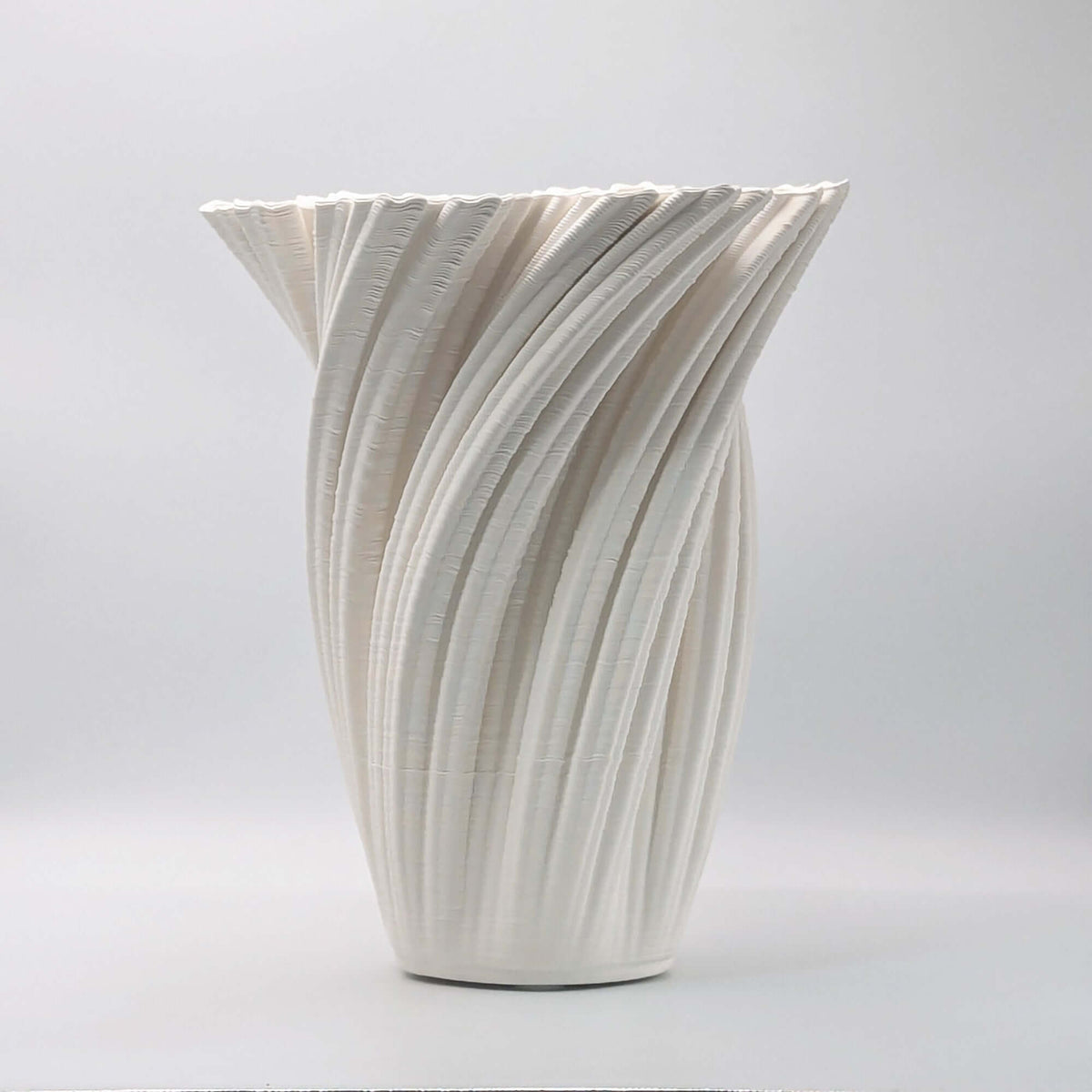 Matte white 3D printed porcelain vase with spiralled design