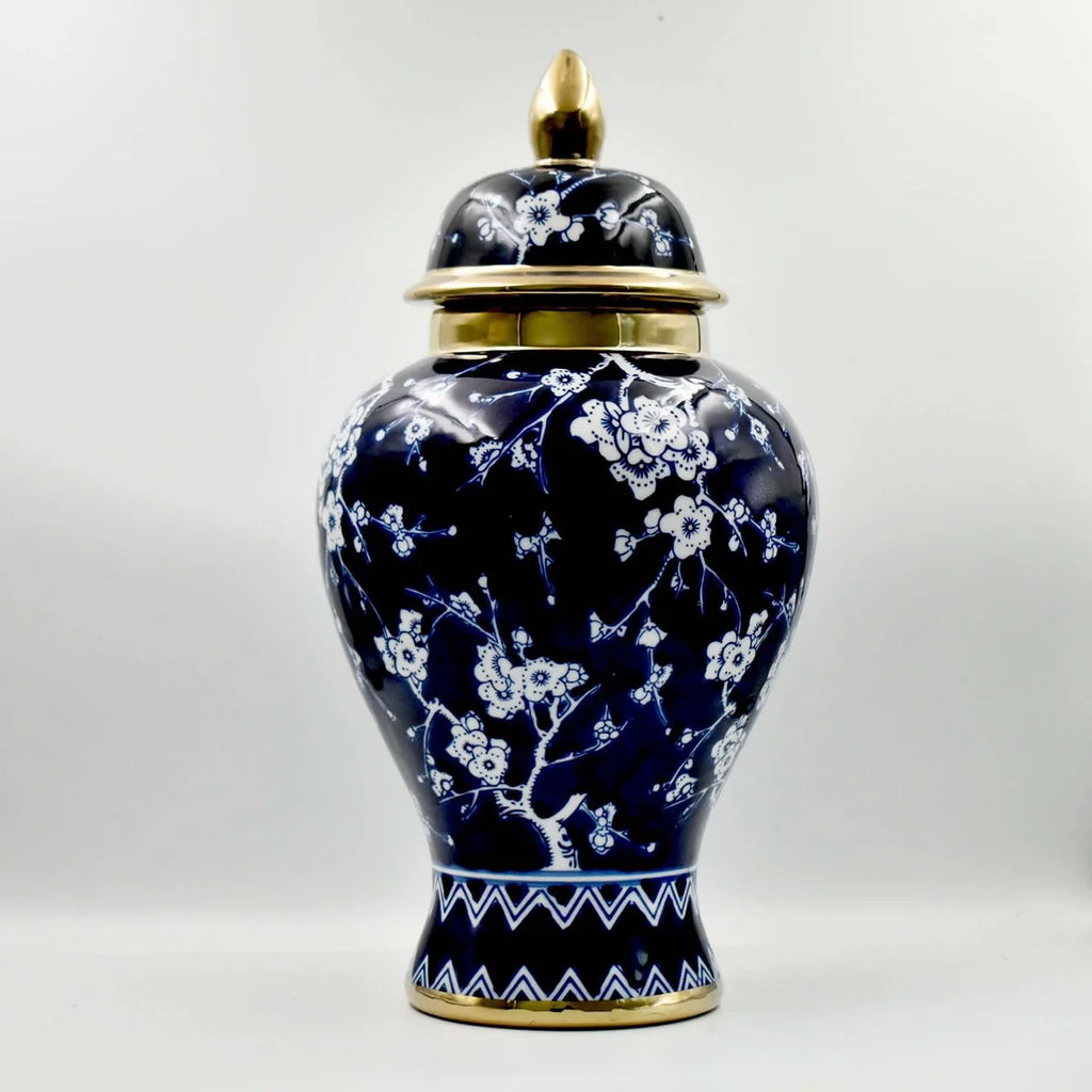 Navy blossom ceramic temple jar with gold accents and lid closed