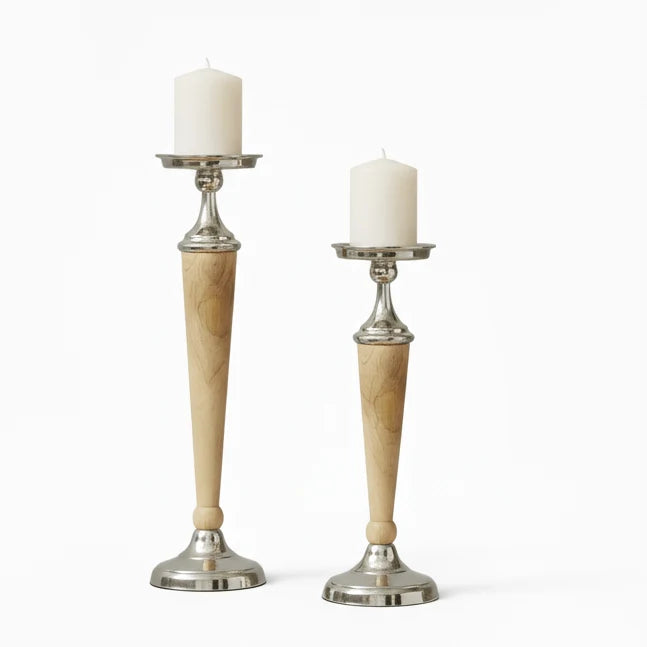 Pair of aluminium and natural wood candle holders with white candles