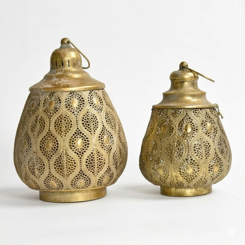 Set of two antique gold perforated iron lanterns, one large and one small, with decorative handles