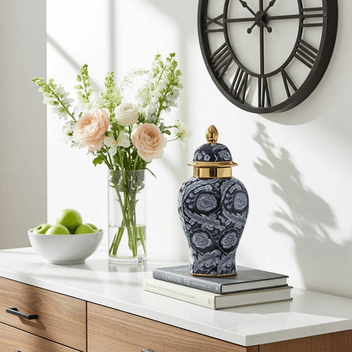 Ginger jar styled on a dresser with books, flowers, and a bowl of apples