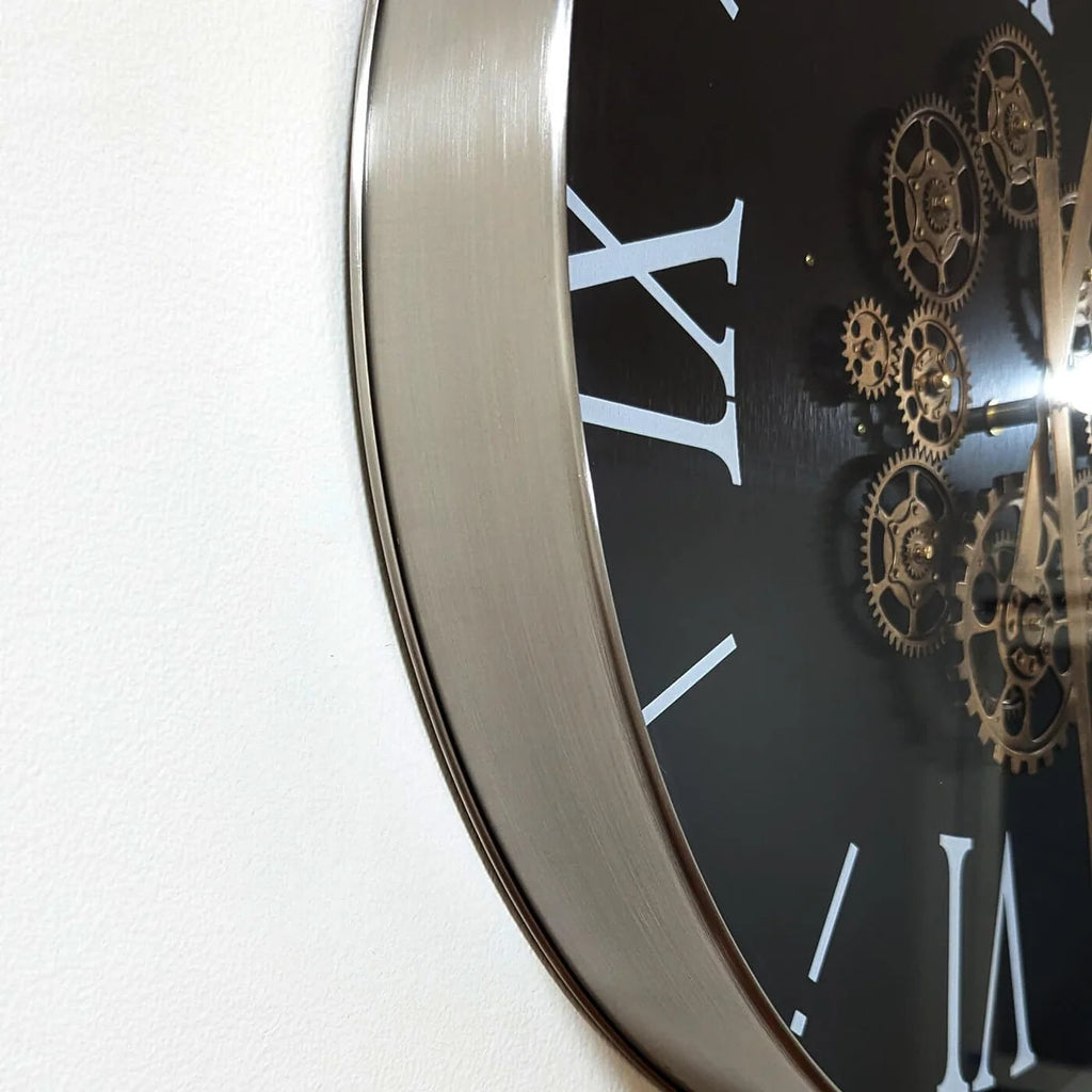 Close-up side view of the clock's metal frame and glass face