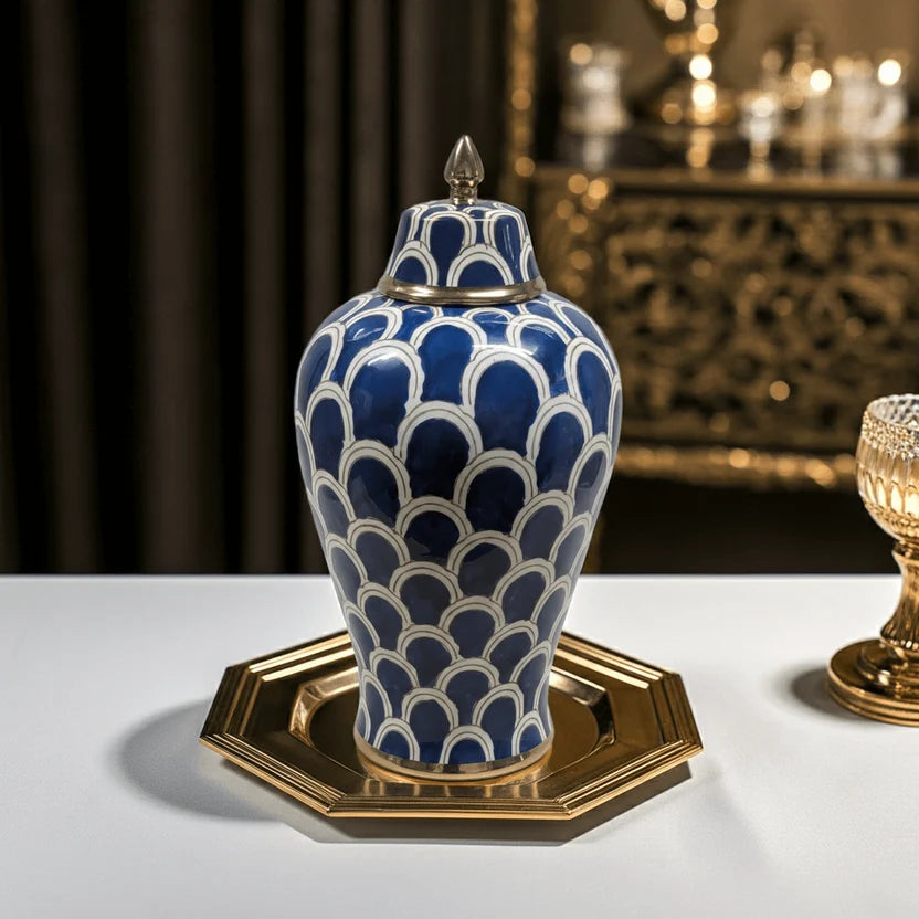 Ceramic ginger jar with gold-plated accents on a tray in a luxury interior