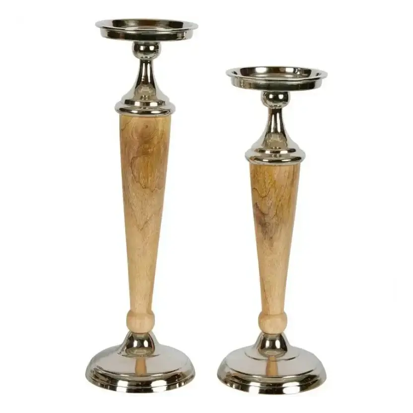 Set of two aluminium and wood candle holders on white background