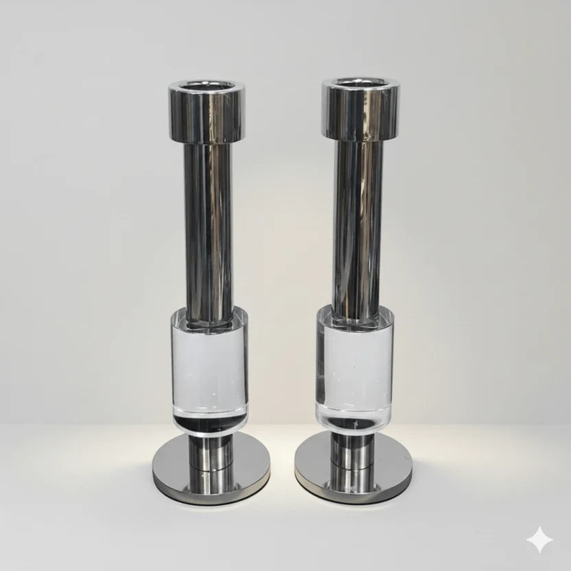 Crystal and chrome candle holder pair displayed under direct lighting