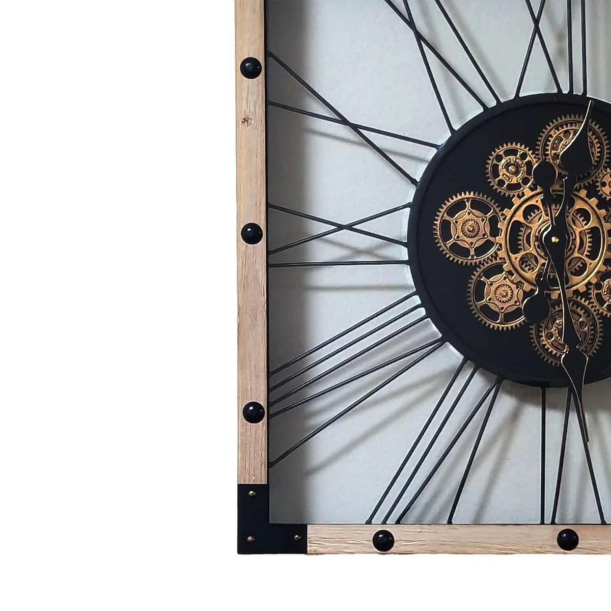 Close-up of gold gear mechanism in industrial wood and metal wall clock